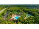 Aerial view showcasing community pool and recreation facilities, providing residents with ample activities at 31814 Larkenheath Dr, Wesley Chapel, FL 33543