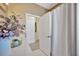 Bright bathroom featuring a light countertop, neutral walls, and an open doorway leading to another room at 31814 Larkenheath Dr, Wesley Chapel, FL 33543