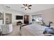 Bright bedroom with light wood floors and high ceilings, offers plenty of natural light at 31814 Larkenheath Dr, Wesley Chapel, FL 33543