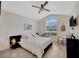 Bright bedroom with natural light featuring a stylish vaulted ceiling and a ceiling fan at 31814 Larkenheath Dr, Wesley Chapel, FL 33543