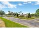 Beautiful community entrance with lush landscaping and a welcoming gate at 31814 Larkenheath Dr, Wesley Chapel, FL 33543