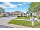 Charming single-story home with a well-manicured lawn and a two-car garage, enhancing its curb appeal at 31814 Larkenheath Dr, Wesley Chapel, FL 33543