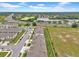 Suburban townhomes featuring attached garages and ample parking, set near scenic ponds and roadways at 3216 Bryant Park Dr, New Port Richey, FL 34655
