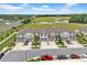 New construction townhomes featuring attached garages, driveways, and manicured landscaping in a suburban setting at 3216 Bryant Park Dr, New Port Richey, FL 34655