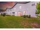 Spacious backyard features a large grassy area and a covered patio for outdoor enjoyment at 3216 Bryant Park Dr, New Port Richey, FL 34655