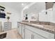 Elegant bathroom featuring double sinks, granite countertops, and modern fixtures for a spa-like experience at 3216 Bryant Park Dr, New Port Richey, FL 34655