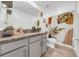Stylish bathroom featuring a gray vanity with granite countertops and a walk-in shower with a decorative curtain at 3216 Bryant Park Dr, New Port Richey, FL 34655