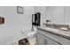 Stylish bathroom features a granite countertop, gray cabinets, and modern fixtures for a luxurious feel at 3216 Bryant Park Dr, New Port Richey, FL 34655