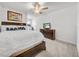 Bedroom featuring carpeting, fan and fixture, TV and dresser, and a view toward the doorway at 3216 Bryant Park Dr, New Port Richey, FL 34655