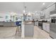 Modern kitchen featuring gray cabinets, granite countertops, and stainless steel appliances at 3216 Bryant Park Dr, New Port Richey, FL 34655