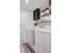 Bright laundry room with a modern washer and dryer, shelving, and laundry-themed decor at 3216 Bryant Park Dr, New Port Richey, FL 34655