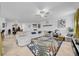 Spacious living room with tile floors, a ceiling fan, and comfortable seating with stylish decorations at 3216 Bryant Park Dr, New Port Richey, FL 34655