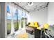 Cozy sunroom with comfortable seating, string lights, and a view of the backyard at 3216 Bryant Park Dr, New Port Richey, FL 34655