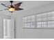Bedroom featuring a ceiling fan, window, and doorway view at 326 Circle Dr, Palm Harbor, FL 34683