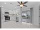 Bright eat-in kitchen with stainless steel appliances and a sliding glass door to the patio at 326 Circle Dr, Palm Harbor, FL 34683