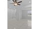 Bright and open living room featuring tile floors and a ceiling fan at 326 Circle Dr, Palm Harbor, FL 34683