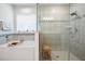 Bright bathroom featuring a tub with tile surround and glass enclosed shower at 344 Dartmouth Ave, Spring Hill, FL 34606