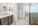 Bathroom with white vanity, tile flooring, and glass-enclosed shower at 344 Dartmouth Ave, Spring Hill, FL 34606