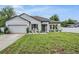 Charming one-story home with a well-manicured lawn, neutral paint, and a two-car garage at 344 Dartmouth Ave, Spring Hill, FL 34606