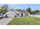 Attractive home with a well-kept lawn, tidy landscaping, and a welcoming entrance at 344 Dartmouth Ave, Spring Hill, FL 34606