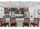 Spacious kitchen features granite counters, dark cabinets, pendant lighting and stainless appliances at 344 Dartmouth Ave, Spring Hill, FL 34606