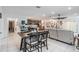 Open-concept living area flows to the kitchen and dining space, with tile floors at 344 Dartmouth Ave, Spring Hill, FL 34606