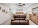 Spacious main bedroom features tray ceilings, ceiling fan, and neutral decor, creating a serene retreat at 344 Dartmouth Ave, Spring Hill, FL 34606