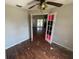 Bright bedroom showcasing unique interior doors and wood-look flooring at 3541 65Th Avenue E Cir, Sarasota, FL 34243
