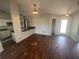 Dining area and open bar with an outdoor view, neutral walls, and hanging lights at 3541 65Th Avenue E Cir, Sarasota, FL 34243