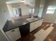 Updated kitchen featuring an island with sink, dishwasher, and barstool seating at 3541 65Th Avenue E Cir, Sarasota, FL 34243