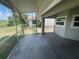 Covered patio with screen enclosure and concrete floor, great for outdoor entertaining at 3541 65Th Avenue E Cir, Sarasota, FL 34243