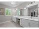 Large primary bathroom boasting double vanity sinks, a makeup area and an oversized mirror at 3605 W Dale Ave, Tampa, FL 33609