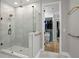 The primary bathroom shower is frameless and the room also has a walk-in closet at 3605 W Dale Ave, Tampa, FL 33609