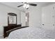 This bedroom has a ceiling fan, carpeted floors, and an open doorway to another room at 3605 W Dale Ave, Tampa, FL 33609