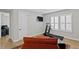 Exercise room featuring hardwood floors, a ceiling fan, and a treadmill at 3605 W Dale Ave, Tampa, FL 33609