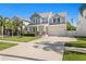Charming two-story home features a manicured lawn and covered front porch, enhancing its curb appeal at 3605 W Dale Ave, Tampa, FL 33609