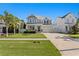 Charming two-story home features a manicured lawn and covered front porch, enhancing its curb appeal at 3605 W Dale Ave, Tampa, FL 33609