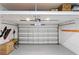 This is a clean garage with an epoxy floor, white walls, and a garage door at 3605 W Dale Ave, Tampa, FL 33609
