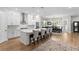 Spacious kitchen boasts white cabinets, a large island with seating, and stainless steel appliances at 3605 W Dale Ave, Tampa, FL 33609