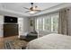 The primary bedroom boasts bright light, plantation shutters and leads to the primary bath at 3605 W Dale Ave, Tampa, FL 33609
