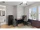 This office has a ceiling fan, a window, and is connected to the bathroom at 3605 W Dale Ave, Tampa, FL 33609