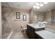 Updated bathroom features a walk-in shower, vanity, and ample lighting for a spa-like experience at 3687 Imperial Ridge Pkwy, Palm Harbor, FL 34684