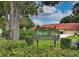 Community sign for Imperial Ridge, a deed-restricted community with lush greenery at 3687 Imperial Ridge Pkwy, Palm Harbor, FL 34684