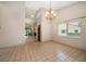 Open floor plan with dining room and tile flooring at 3687 Imperial Ridge Pkwy, Palm Harbor, FL 34684