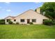 A well-maintained home with a manicured lawn, beautiful shrubbery and a brick walkway at 3687 Imperial Ridge Pkwy, Palm Harbor, FL 34684