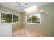 Bright laundry room with large windows and tile flooring at 3687 Imperial Ridge Pkwy, Palm Harbor, FL 34684