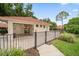 A view of the community pool house with a gated entrance and access to the pool at 3687 Imperial Ridge Pkwy, Palm Harbor, FL 34684