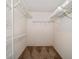 Spacious walk-in closet with ample storage space with wire shelving at 3687 Imperial Ridge Pkwy, Palm Harbor, FL 34684