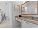 Bright bathroom featuring granite countertop vanity and access to the bedroom creating a convenient and stylish space at 3707 Smoke Hickory Ln, Valrico, FL 33596