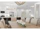 Dining room view into the kitchen with island seating and modern decor at 3707 Smoke Hickory Ln, Valrico, FL 33596